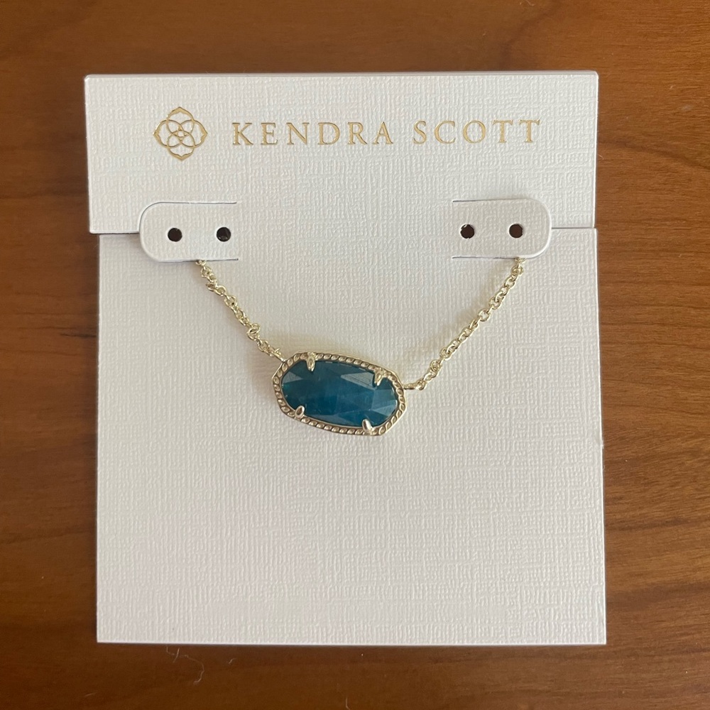 Kendra Scott Elisa necklace in gold with a turquoise stone.